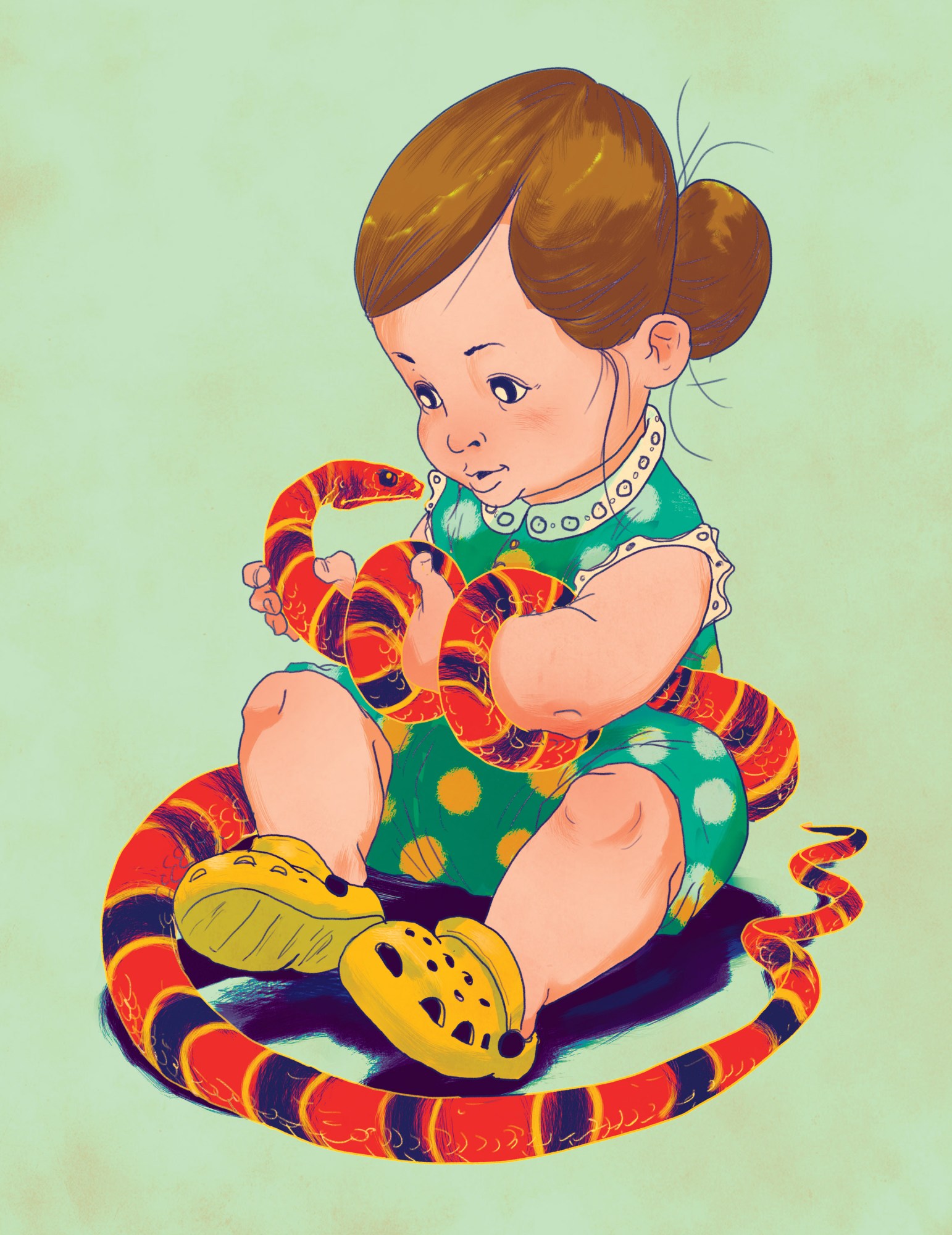 little girl holding a snake